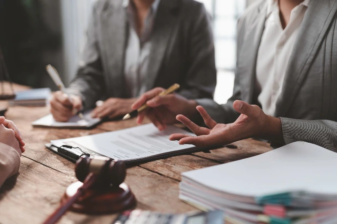 group of lawyers discussing marketing strategies with their Bayer Enterprises