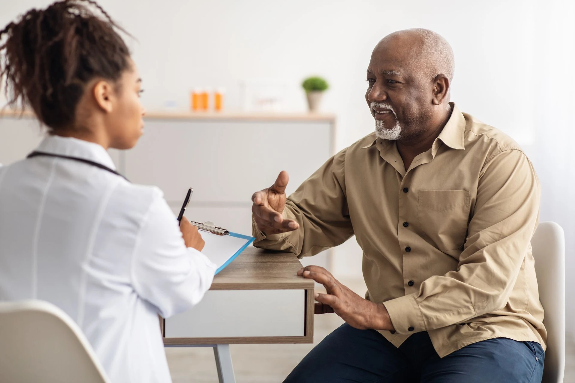 A male doctor consulting with his female doctor in a white coat seo for the healthcare industry